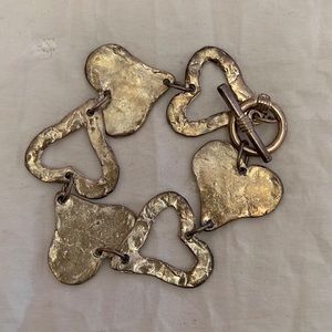 Metal heart bracelet.